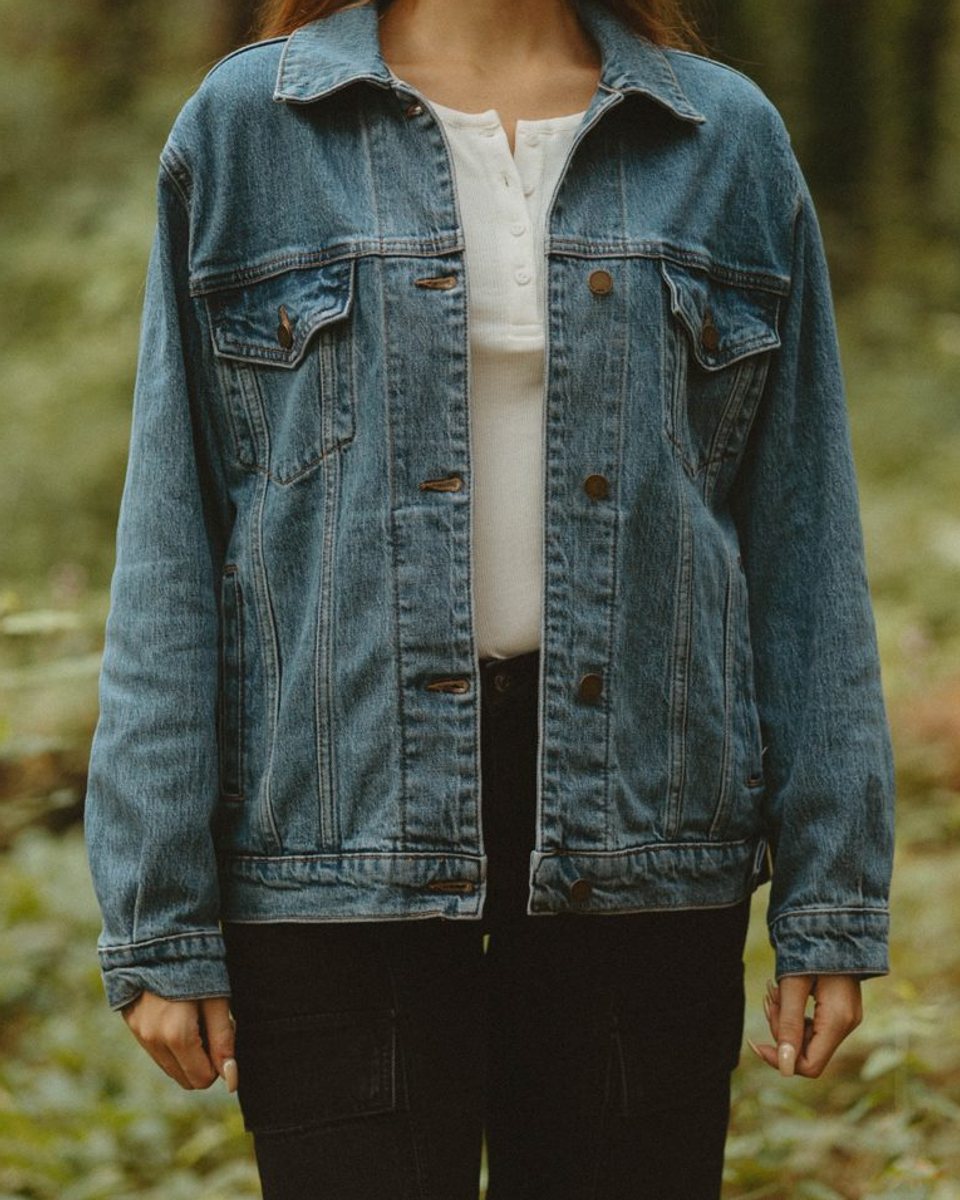 A denim jacket over a white henley